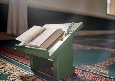 Quran, prayer beads and mosque with an open book and a rosary in an empty holy room or temple ready.